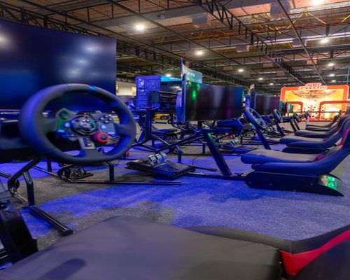 Australian gaming event lounge with players and monitors